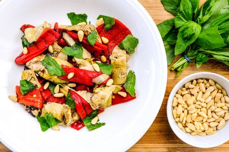 Healthy Roast Vegetarian Red Pepper and Artichoke Salad With Pine Kernels and Basilの写真素材