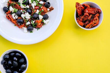 Traditional Greek Style Salad With Feta Cheese, Sundried Tomatoes and Black Olivesの写真素材