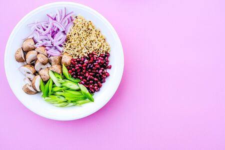 Vegetarian Mushroom and Rice Poke Bowl, With Chestnut Mushrooms, Pomegranate Seeds, Spring Oniond and Red Onionsの写真素材