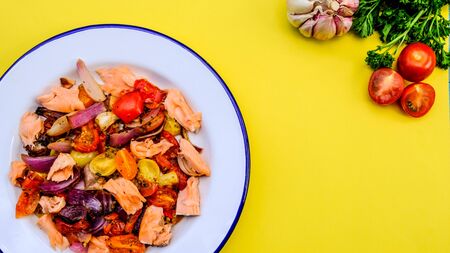 Healthy Fresh Salmon Fillet With Roasted Vegetables, Including Cherry Tomatoes, Red Onions and...