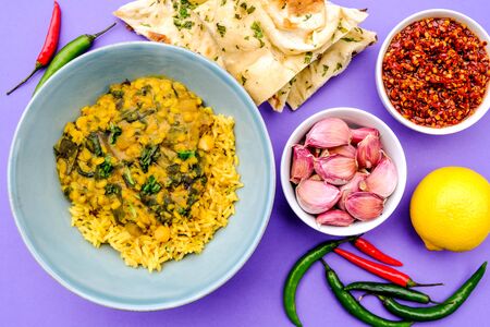 Indian Vegetarian Lentil and Spinach Curry With Pilau Yellow Riceの写真素材