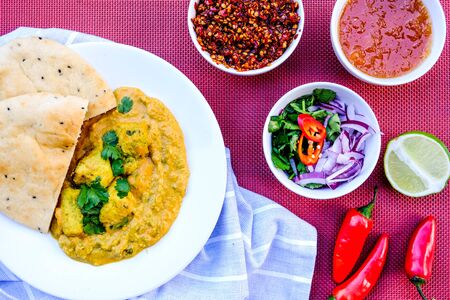 Traditional Indian Chicken Korma Curry Meal With Naan Bread