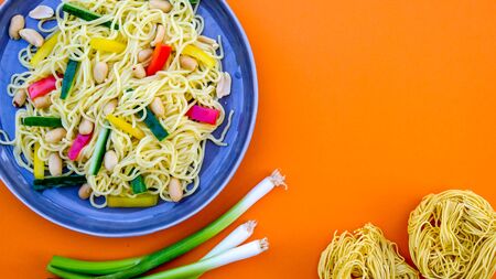 Noodle and Peanut Salad With Roasted Peanuts, Spring Onions Red and Yellow Peppersの写真素材