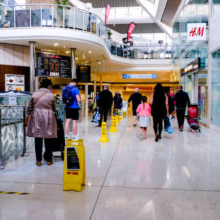 Shoppers Queue To Enter A Supermarket For Food Shopping Inside A South London Shopping Mall, While Social Distancingのeditorial素材