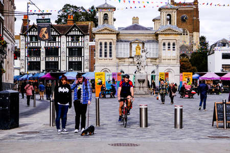 Open Air Quiet Kingston Market Square With A Cyclist And People Walking