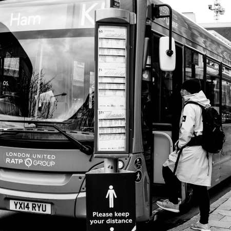 London UK October 06 2020, A Single Male Passenger Stepping Onboard A Public Transport Bus