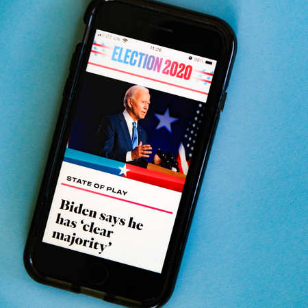 London UK, November 07, 2020, Mobile Phone Screen Showing Trump Agaist Biden In The 2020 American...