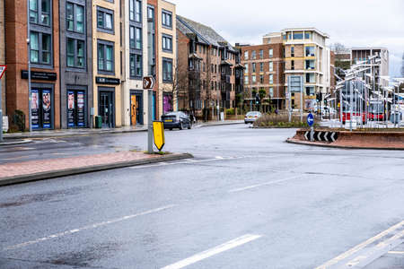 London UK, March 26 2021, Apartments or Flats Property Market Against A Wet Empty Road With No...