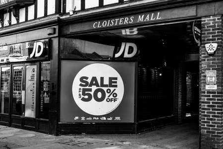 Kingston, London UK, April 7 2021, JD Sports Shop Or Store Window Poster Advertising a 50% Sale discount Of Stock With No Peopleのeditorial素材