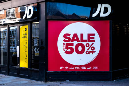 Kingston, London UK, April 7 2021, JD Sports Shop Or Store Window Poster Advertising a 50% Sale...