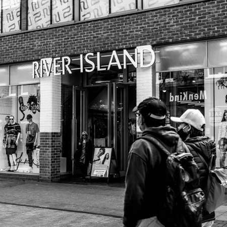 Kingston Upon Thames London, May 07 2021, Two People Or Shoppers Walking Past A River Island Fashion...