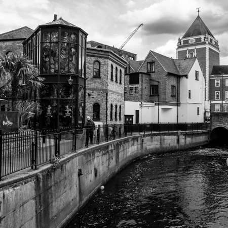 Kingston Upon Thames Surrey London UK May 07 2021, A Riverside Walk Or Pathway With A Person Against Modern And Traditional Architectureのeditorial素材