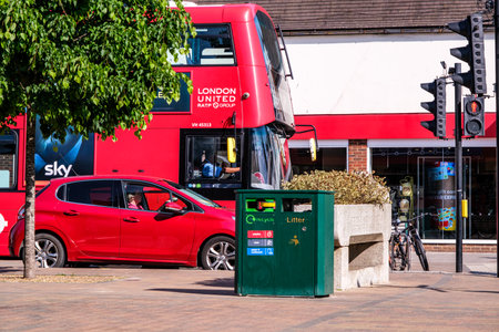 Epsom Surrey, London, May 09 2022, Red London double Decker Bus And Red Passenger Car Waiting At Traffic Lightsのeditorial素材