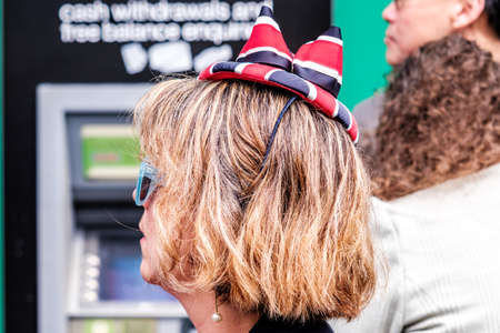 Epsom Surrey, London UK, June 04 2022, Woman With Short Blonde Hair Wearing Union Jack Novelty Hatのeditorial素材