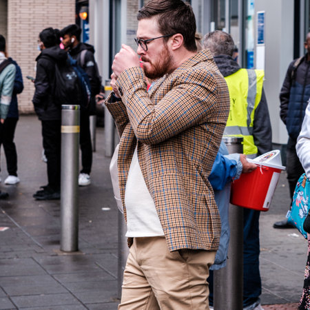 Epsom Surrey, London UK, June 04 2022, Man Wearing Casual Smart Checked Sports Jacket Lighting A...