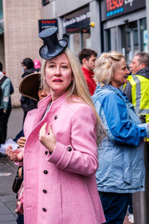 Epsom Surrey, London UK, June 04 2022, Attractive Woman Wearing A Pink Coat And A Novelty Top Hatのeditorial素材
