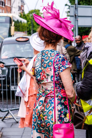 Epsom Surrey, London UK, June 04 2022, Attractive Older Woman Wearing Floral Print Summer Dress And Pink Headwearのeditorial素材