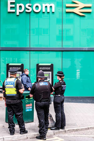 Epson Surrey, London UK, June 03 2022, Three Police Offices Standing Outside Epsom Railway Station