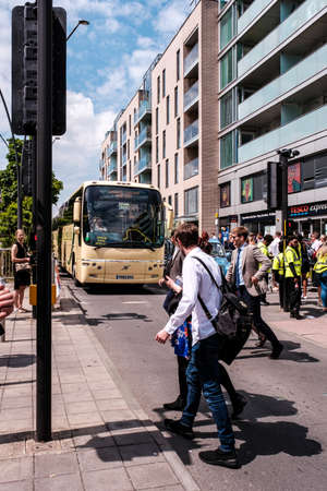 Epson Surrey, London UK, June 03 2022, People Crossing Road Infront Of A Public Transport Coachのeditorial素材