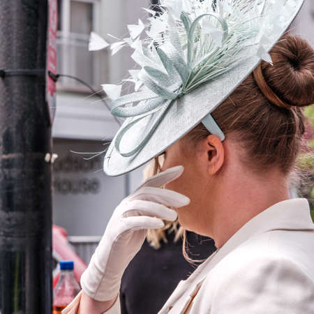 Epsom Surrey, London UK, June 04 2022, Profile Beautiful Young Woman Wearing Fascinator Hat And White Glovesのeditorial素材