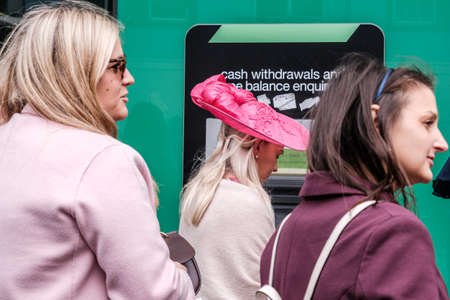 Epsom Surrey, London UK, June 04 2022, Three Woman Queuing At ATM Cash Point Machineのeditorial素材