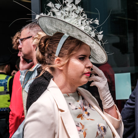 Epsom Surrey, London UK, June 04 2022, Young Woman Wearing Detailed Fascinator Hat, Print Dress And Glovesのeditorial素材