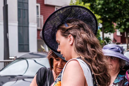 Epsom Surrey, London UK, June 04 2022, Beautiful Young Woman Wearing Black Facinator Hat With Long Brown Hairのeditorial素材