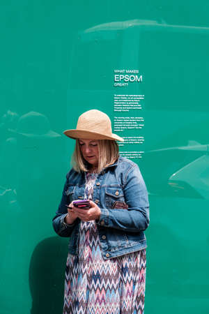 Epsom Surrey, London UK, June 04 2022, One Woman Standing Alone Using Mobile Phoneのeditorial素材