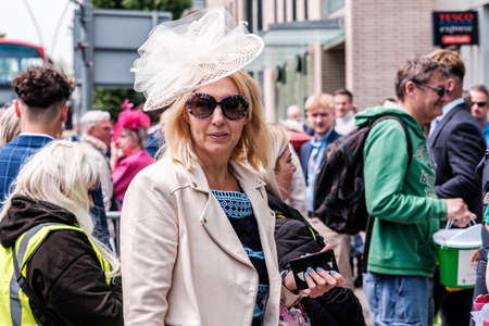 Epsom Surrey, London UK, June 04 2022, Woman Standing Alone On A Crowded Street Wearing Facinater And Sunglassesのeditorial素材