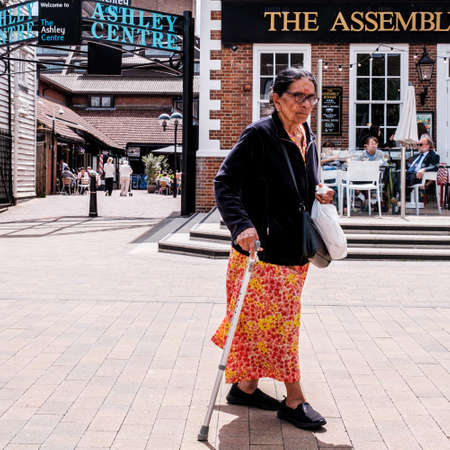 Epsom Surrey, London UK, June 10 2022, Senior Woman Of Asian Origin With A Walking Stickのeditorial素材