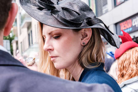 Epsom Surrey, London UK, June 04 2022, Side Profile Portait Beautiful Woman Wearing Navy Blue Fascinator Hat Cazoo Derbyのeditorial素材