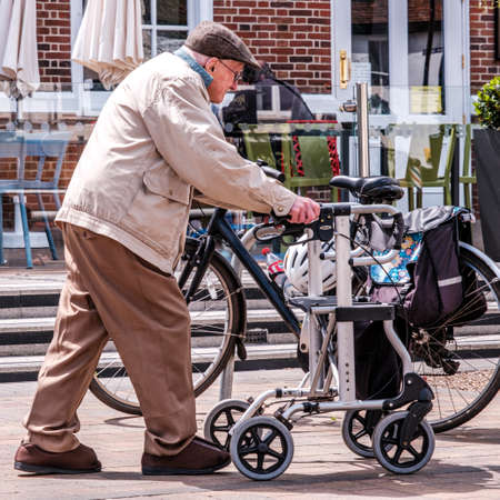 Epsom Surrey, London UK, June 10 2022, Elderly Older Man Using A Walking Frame To Assist Walkingのeditorial素材