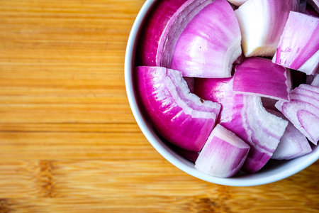 London UK, July 15 2025, A Bowl Of Chopped Fresh Raw Red Onion Cooking Ingredient