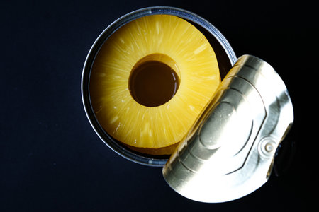 London UK, June 06 2025, Open Tin Or Can Of Healthy Pineapple Rings Tropical Fruitの写真素材