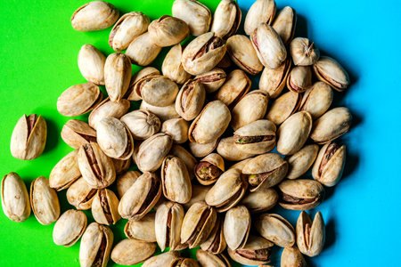 London UK, June 07 2025, A Pile Or Group Of Healthy Salt and Pepper Pistachio Nuts In Their Shellsの写真素材