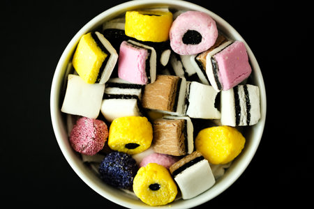 London UK, May 17 2025, A Bowl of Classic Liquorice Allsorts Sweetsの写真素材