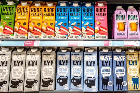 London UK, December 12 2025, Selection Of Supermarket Cartons Of Oat Drinks And Dairy Alternativesのeditorial素材