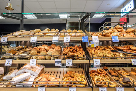 London UK, April 01 2026, Display Of Freshly Baked Supermarket Bread Rolls And Pastries