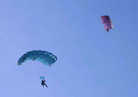 Two parachutes on a bright sunny day.の写真素材