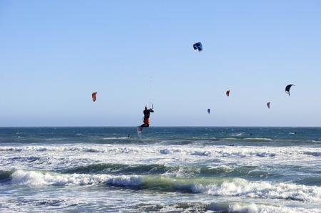Several kitesurfers on Pacific coast.の写真素材