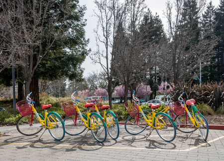Mountain View, CA, USA - March 3, 2017 - Google bicycles scattered in from of Google headquarters with one bicycle malfunctioned because of the crooked wheel in Mountain View, CA, USA, on March 3rd, 2017.のeditorial素材