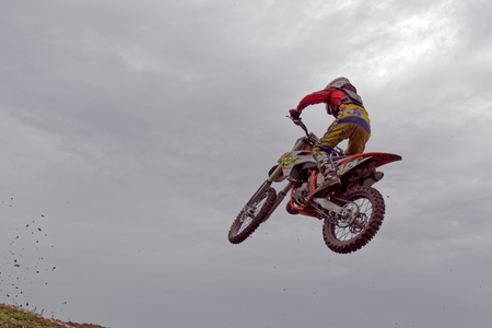 Motocross sports. Motorcycle racing cross country. Jumping on a motorcycle. Mass sports competitions. Russia. Championship Motocross city of Tulaのeditorial素材