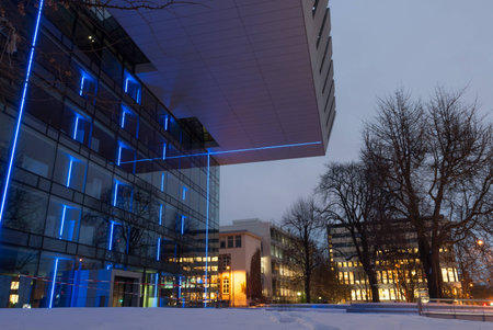 Overhanging modern glass building, architectureの写真素材