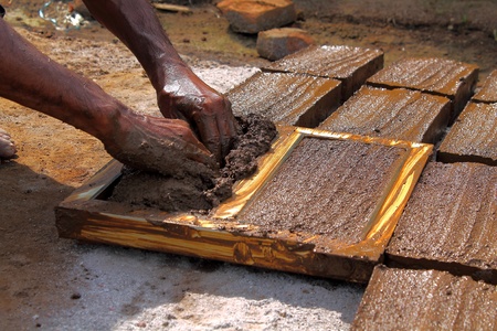 Workers, was leveled in the mold of clay bricks の写真素材