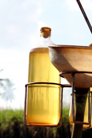 Gasoline in a bottle and a funnel for retail saleの写真素材
