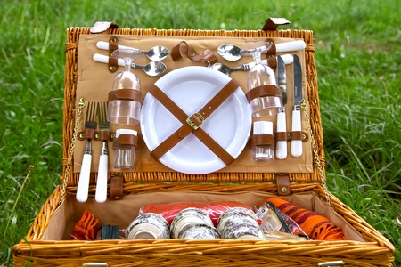 picnic basket on grassの写真素材