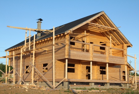 wooden house under constructionの写真素材