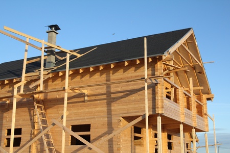 wooden house under constructionの写真素材