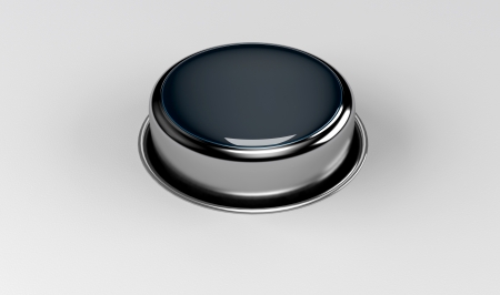 giant glossy metal button on white backgroundの写真素材