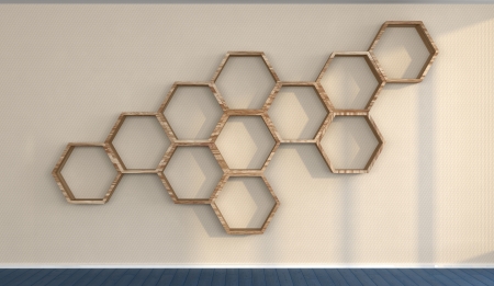 the wall in an abstract interior with hexagonal wooden shelves mounted on itの写真素材
